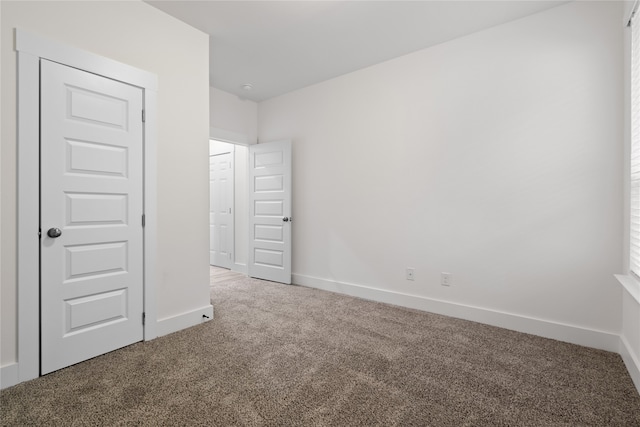 unfurnished bedroom featuring carpet