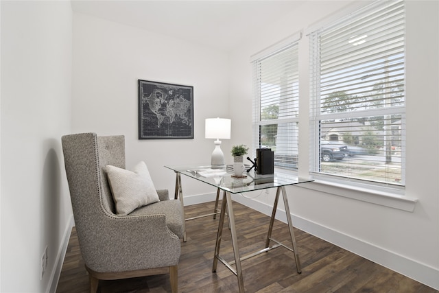 office space with plenty of natural light and dark wood-type flooring