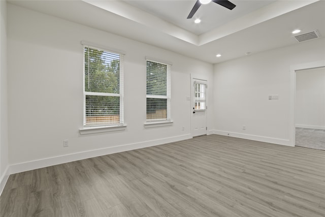 unfurnished room featuring ceiling fan and light hardwood / wood-style flooring