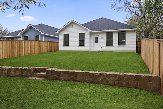 back of house featuring a yard