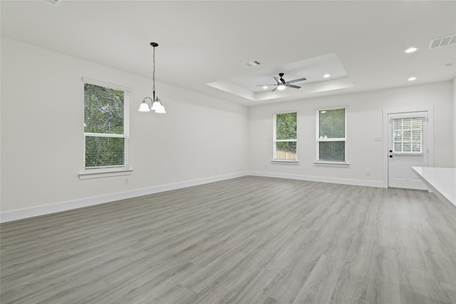 unfurnished living room with light hardwood / wood-style floors and plenty of natural light