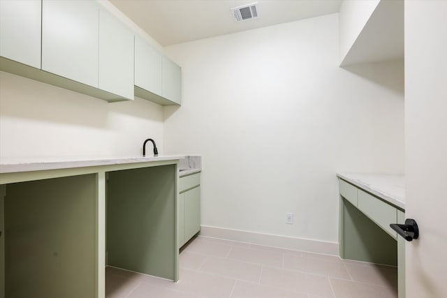 washroom with light tile patterned floors