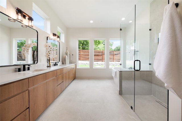 bathroom featuring vanity and plus walk in shower