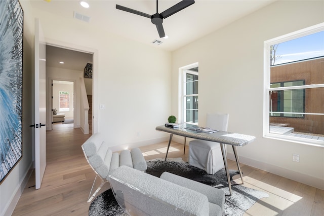 office area featuring light hardwood / wood-style floors and ceiling fan