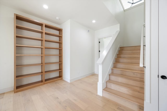 stairway featuring hardwood / wood-style floors