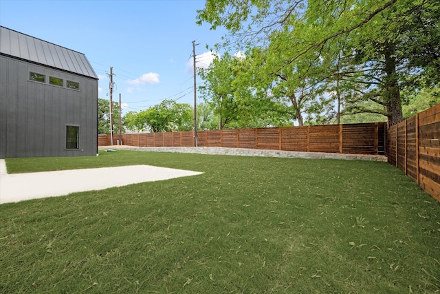 view of yard featuring a patio and a shed