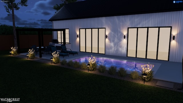 back house at dusk with a yard and a patio area