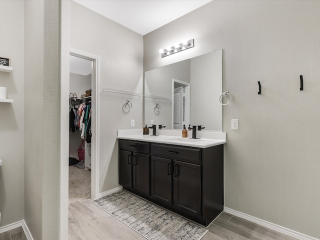 bathroom featuring vanity and hardwood / wood-style flooring