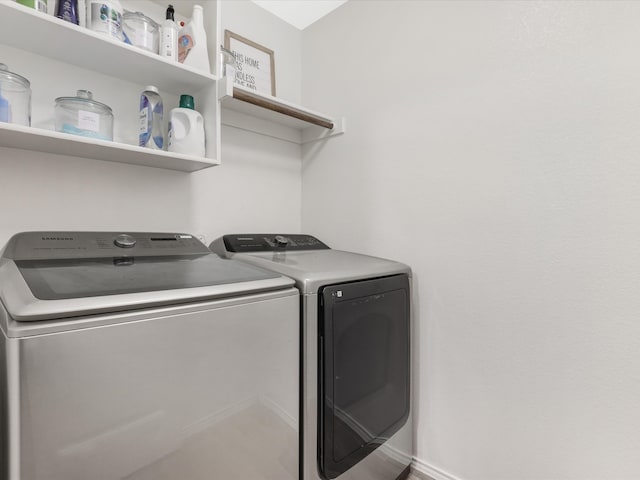 washroom with washing machine and dryer