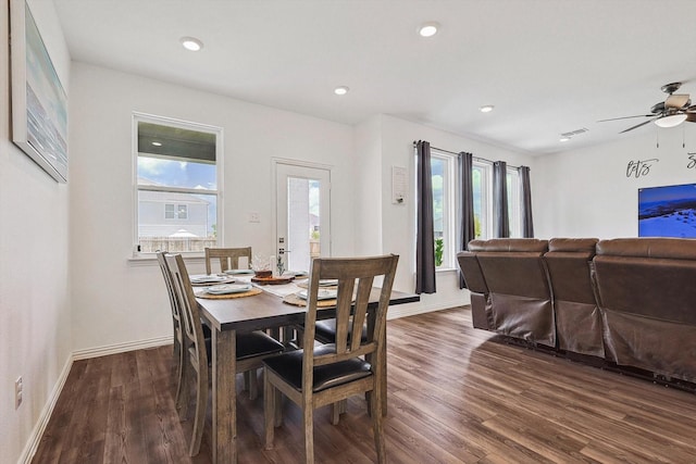 dining area with dark hardwood / wood-style floors and ceiling fan