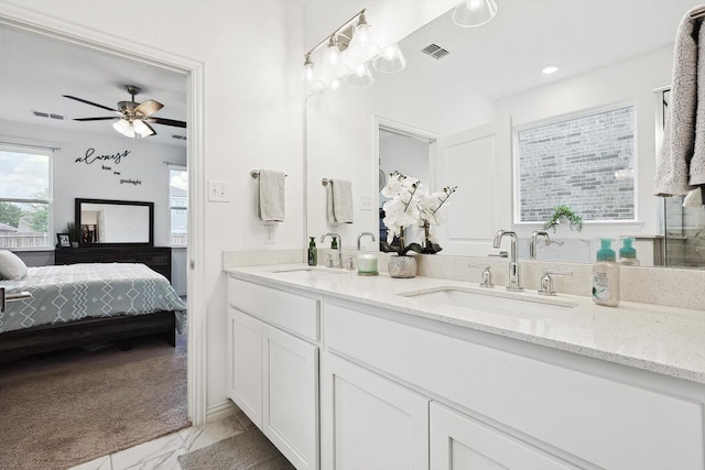 bathroom with ceiling fan and vanity