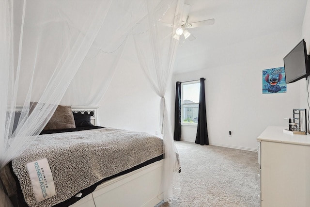 bedroom with ceiling fan and light colored carpet