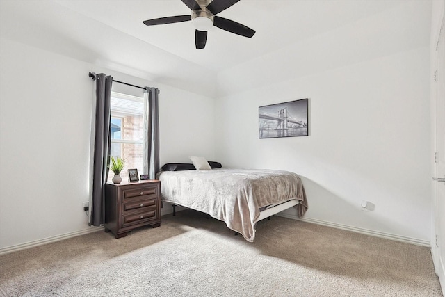 bedroom featuring light carpet and ceiling fan