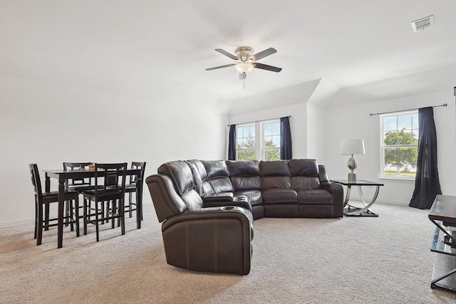 living room with light colored carpet, plenty of natural light, and ceiling fan