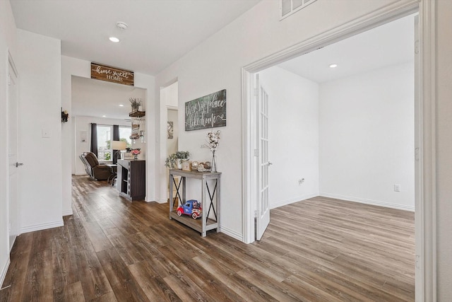 corridor featuring hardwood / wood-style floors