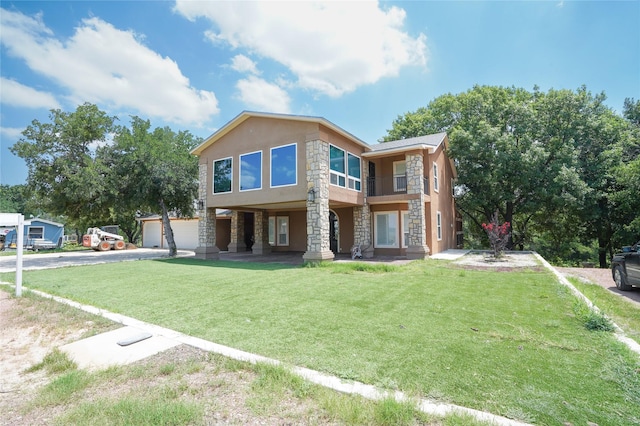 view of front of property with a front lawn and a garage