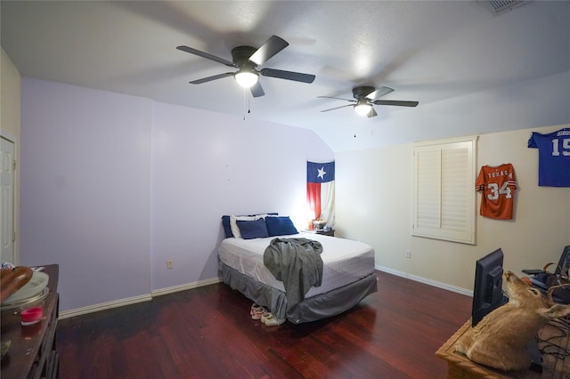 bedroom featuring dark hardwood / wood-style flooring and ceiling fan