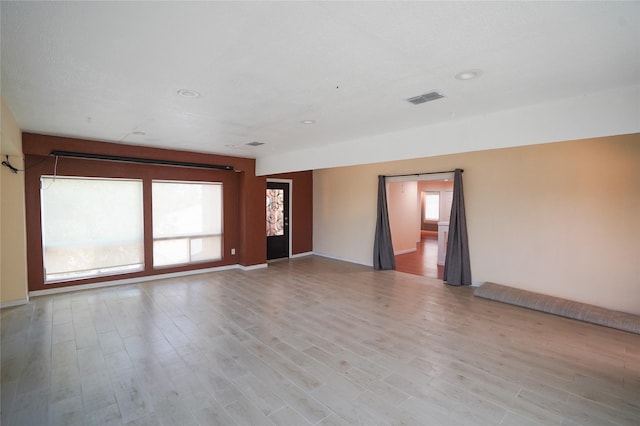 unfurnished room featuring light wood-type flooring