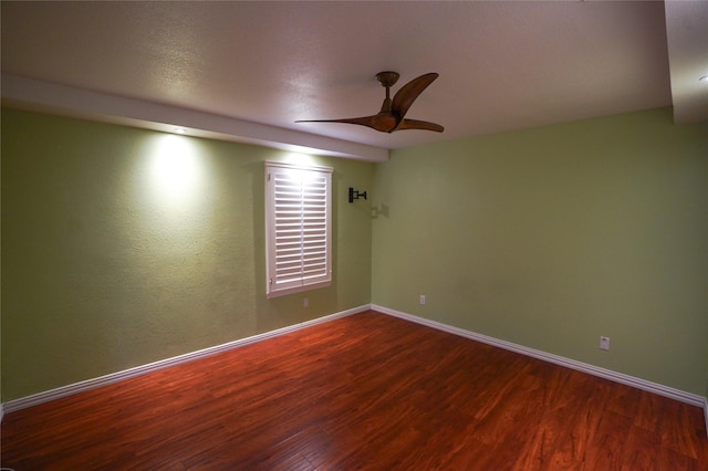 spare room featuring hardwood / wood-style floors and ceiling fan