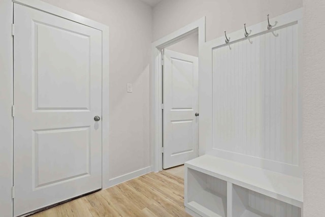 mudroom with light hardwood / wood-style floors