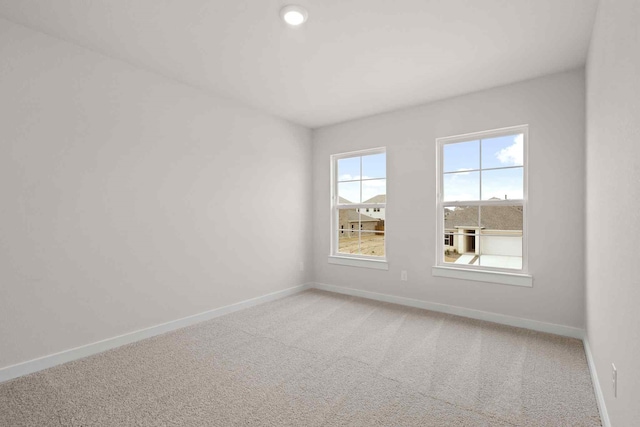 unfurnished room with carpet flooring