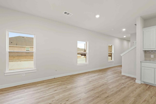 unfurnished living room with light wood-type flooring