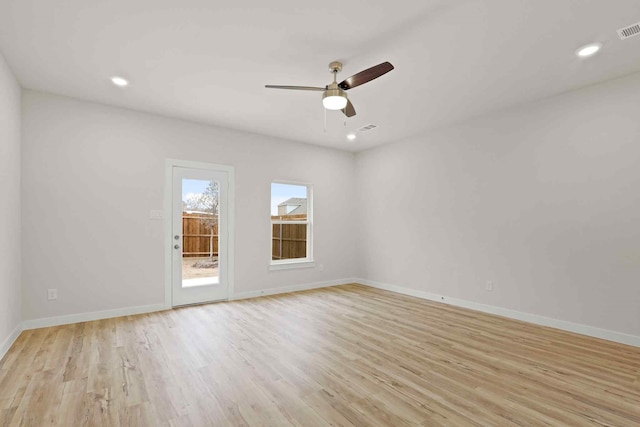 unfurnished room with light hardwood / wood-style flooring and ceiling fan