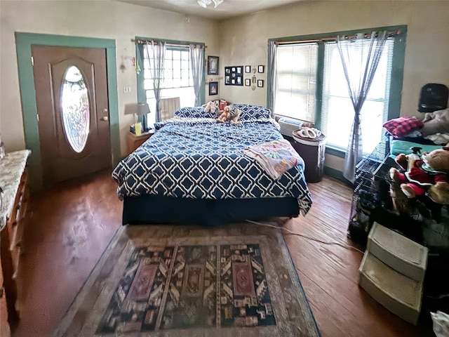 bedroom with hardwood / wood-style floors