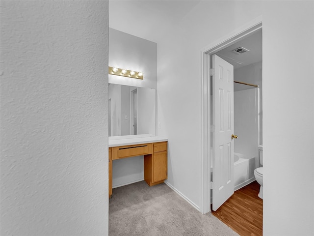 full bathroom with toilet, vanity, and tub / shower combination