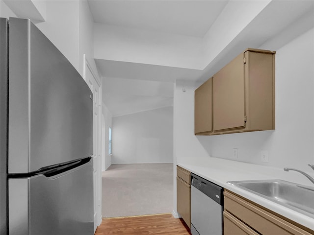 kitchen featuring sink, stainless steel appliances, light hardwood / wood-style flooring, and light brown cabinets