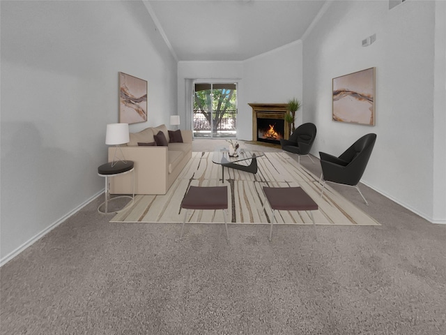 sitting room with crown molding and carpet flooring