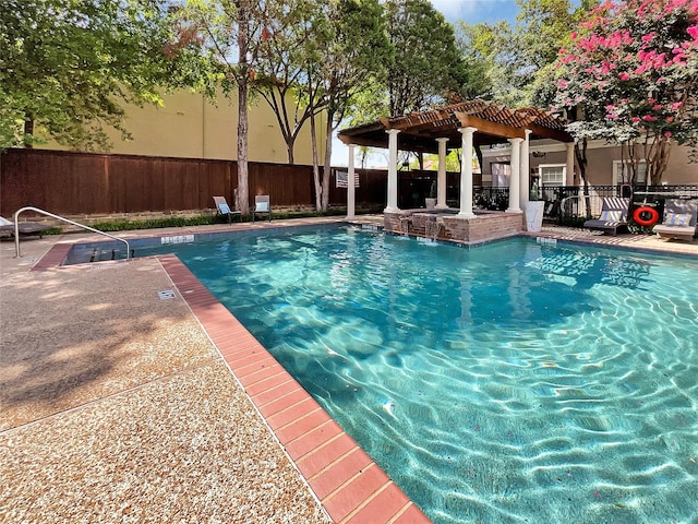 view of pool with a pergola and a patio