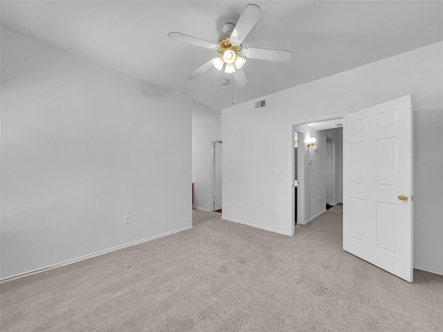 carpeted empty room featuring ceiling fan