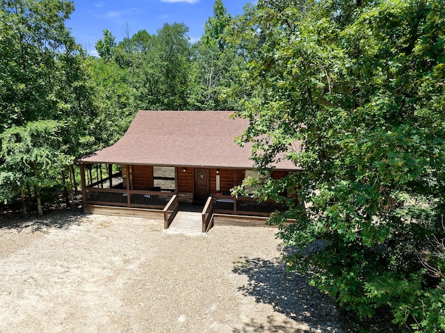 cabin with a wooden deck