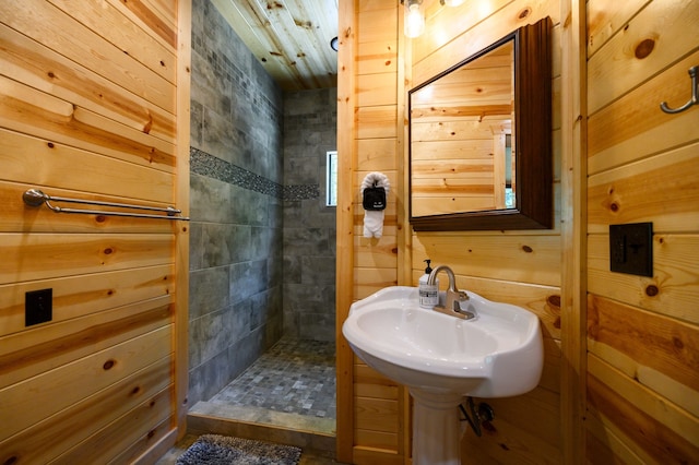 bathroom with a tile shower