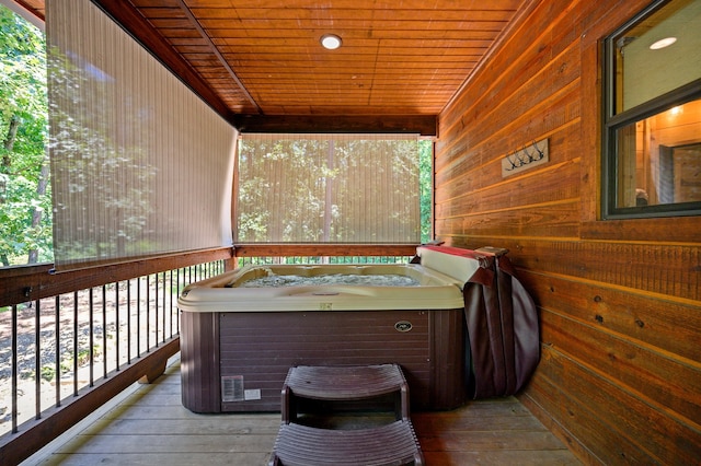 wooden terrace featuring a hot tub