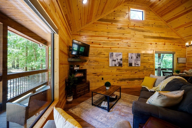 living room featuring wooden ceiling, lofted ceiling, wooden walls, and hardwood / wood-style floors