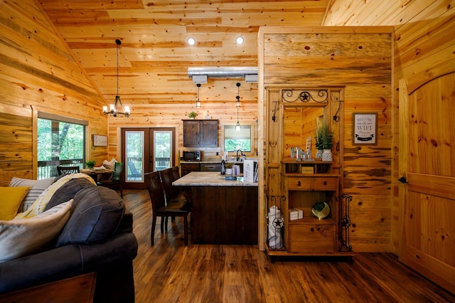 interior space with an inviting chandelier, vaulted ceiling, wood ceiling, and dark hardwood / wood-style flooring