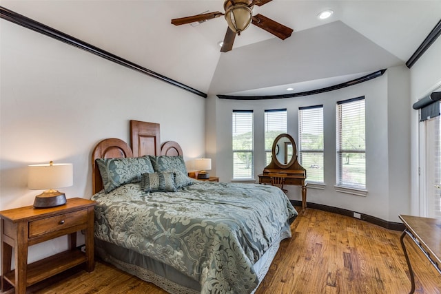 bedroom featuring ceiling fan, lofted ceiling, and light wood-type flooring