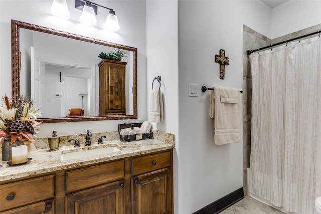 bathroom featuring vanity and a shower with shower curtain