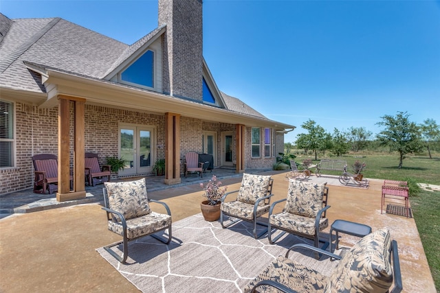 view of patio featuring french doors