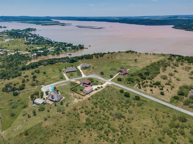 aerial view with a rural view and a water view