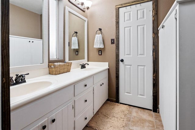 bathroom featuring tile patterned flooring and vanity