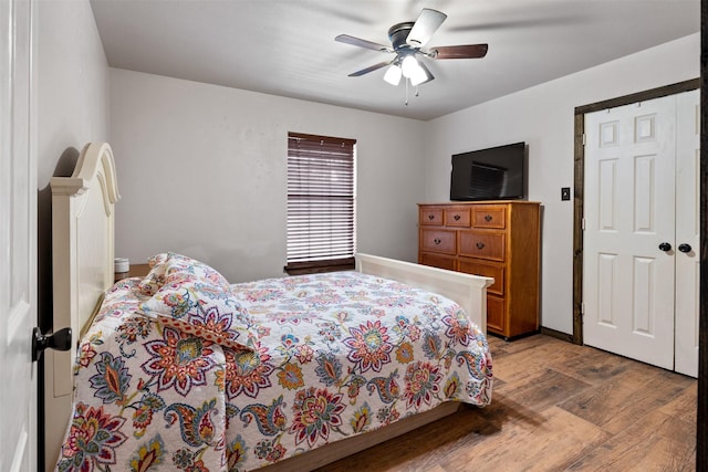 bedroom featuring hardwood / wood-style flooring and ceiling fan