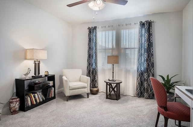 sitting room with carpet and ceiling fan