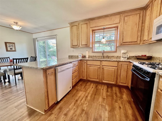 kitchen with white appliances, light hardwood / wood-style floors, sink, kitchen peninsula, and light stone counters