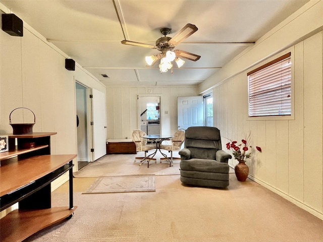 sitting room with light carpet and ceiling fan