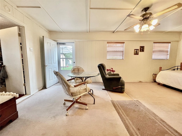 bedroom with ceiling fan and light carpet