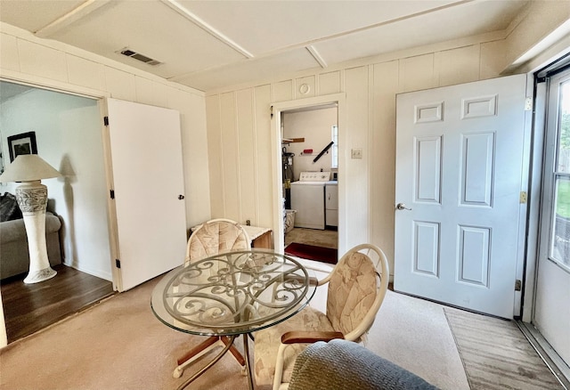 dining room featuring washing machine and dryer and carpet flooring