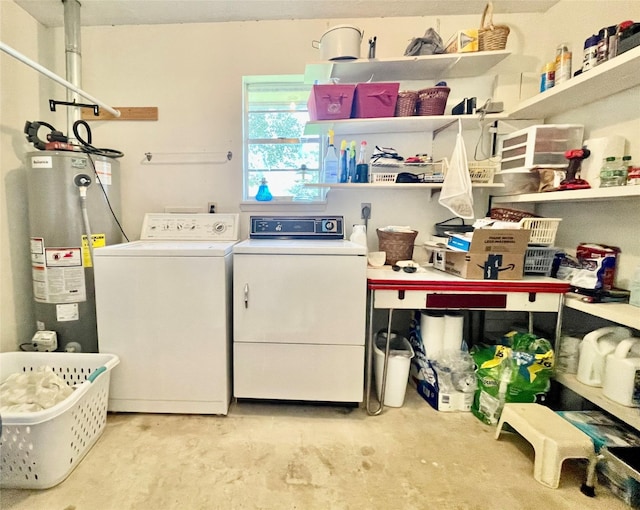 clothes washing area with water heater and separate washer and dryer